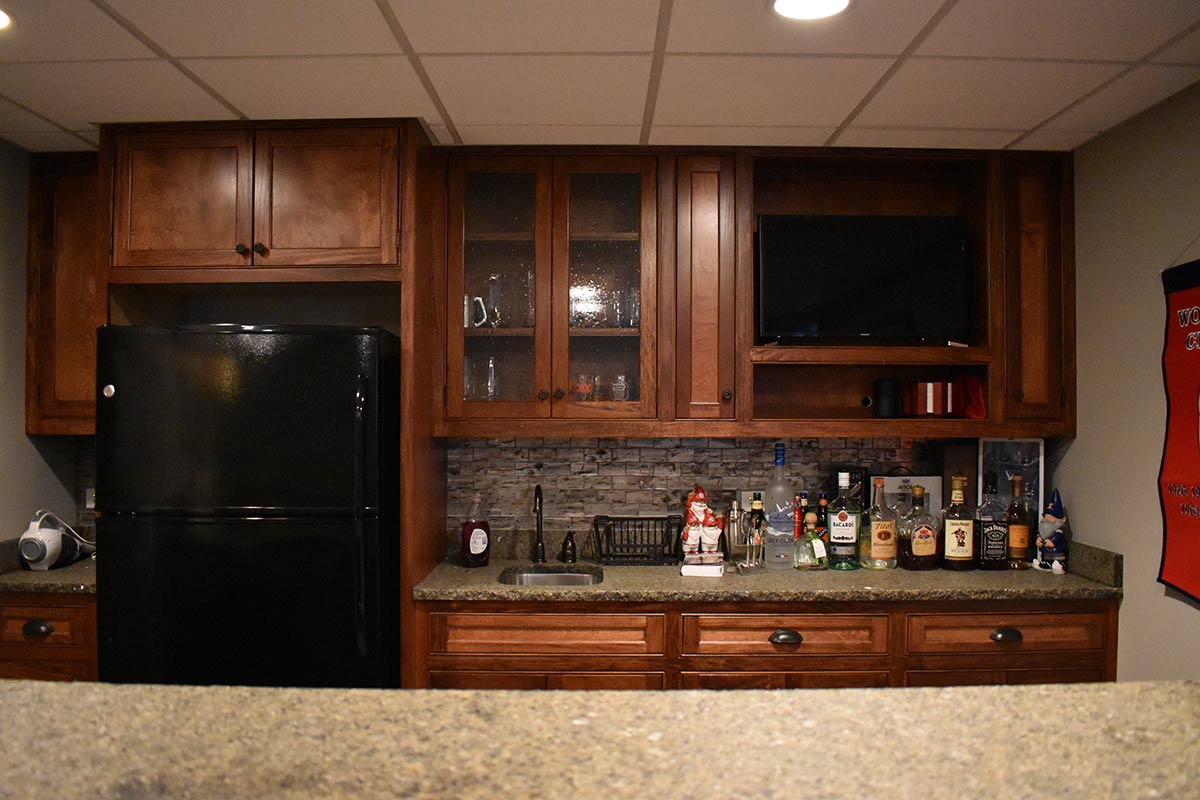 Custom kitchen and bar in basement remodel