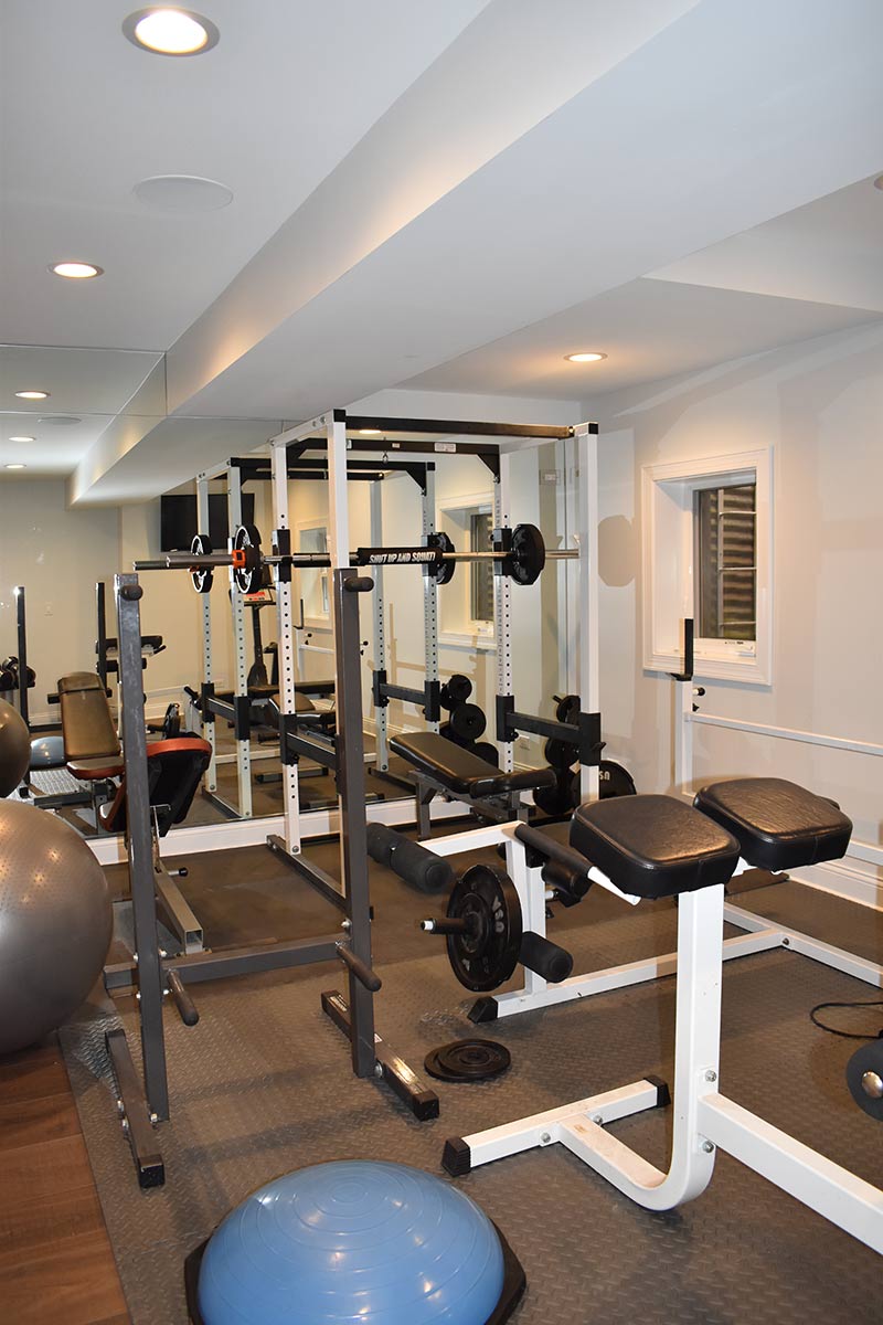 Home gym in custom basement remodel
