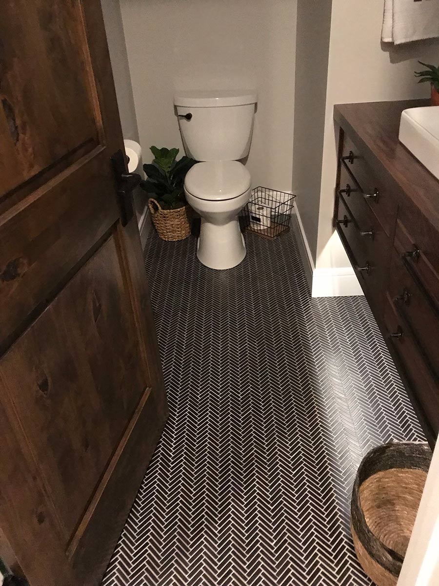 Bathroom remodel with herringbone tile floor